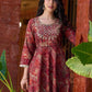 Exquisite deep maroon printed kurta with a graceful bias silhouette, intricate handwork on the yoke, and scalloped sleeve detailing.