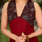 Statement sleeveless Ajrakh dress elevated with a folded collar and graceful maroon pleats.