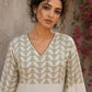 Contemporary off white and olive hand block print top features subtle geometric motifs, airy bell sleeves, and effortless elegance for versatile everyday styling.