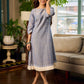 Two-tone handloom cotton dress with delicately painted Madhubani fish motifs and pleated hem.