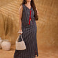 Textured grey Jamdani sleeveless waistcoat with bold red accents and an asymmetrical opening, creating a sharp, modern silhouette with distinctive, fashion-forward appeal.