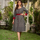 Elegant black grey mercerised Ikat shirt dress featuring a soft square neck, subtle maroon detailing, and a waist belt for a gently flowing silhouette.