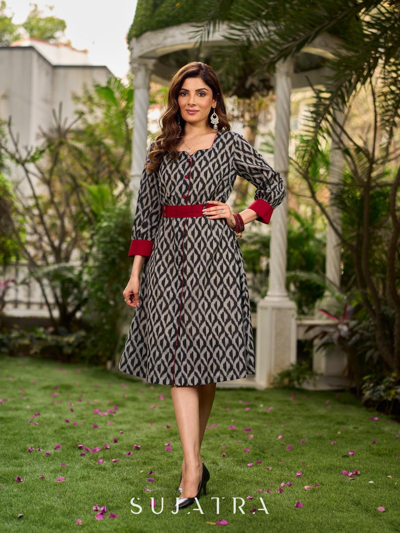 Elegant black grey mercerised Ikat shirt dress featuring a soft square neck, subtle maroon detailing, and a waist belt for a gently flowing silhouette.