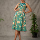 Green peacock motif printed dress with straight neckline and orange accents