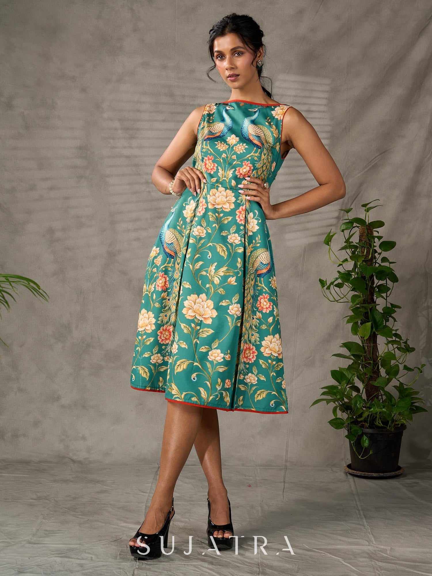 Green peacock motif printed dress with straight neckline and orange accents