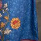 Indigo Kalamkari printed dress with vibrant red and mustard accents.