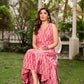 Graceful pink Ikat long dress accented in white, designed with gathered detailing at the fall and a clean sleeveless finish