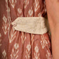 Chic champagne beige Ikat dress elevated with Hakoba accents, a relaxed drop-shoulder fit, mandarin neckline, and fluid side gathers detailed with Hakoba flaps.