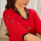 Elegant red dress featuring delicate, hand-painted Madhubani lotus motif detailing.