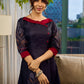 Elegant black Kalamkari-inspired dress with deep maroon accents and graceful floral motifs.