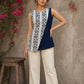 Contemporary off white and navy hand block print top featuring striking geometric motifs, an asymmetric layered silhouette, and effortless elegance