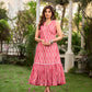 Graceful pink Ikat long dress accented in white, designed with gathered detailing at the fall and a clean sleeveless finish