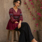 Bold and playful maroon hand block print peplum top with beige geometric motifs and subtle blue accents for effortlessly chic everyday style.