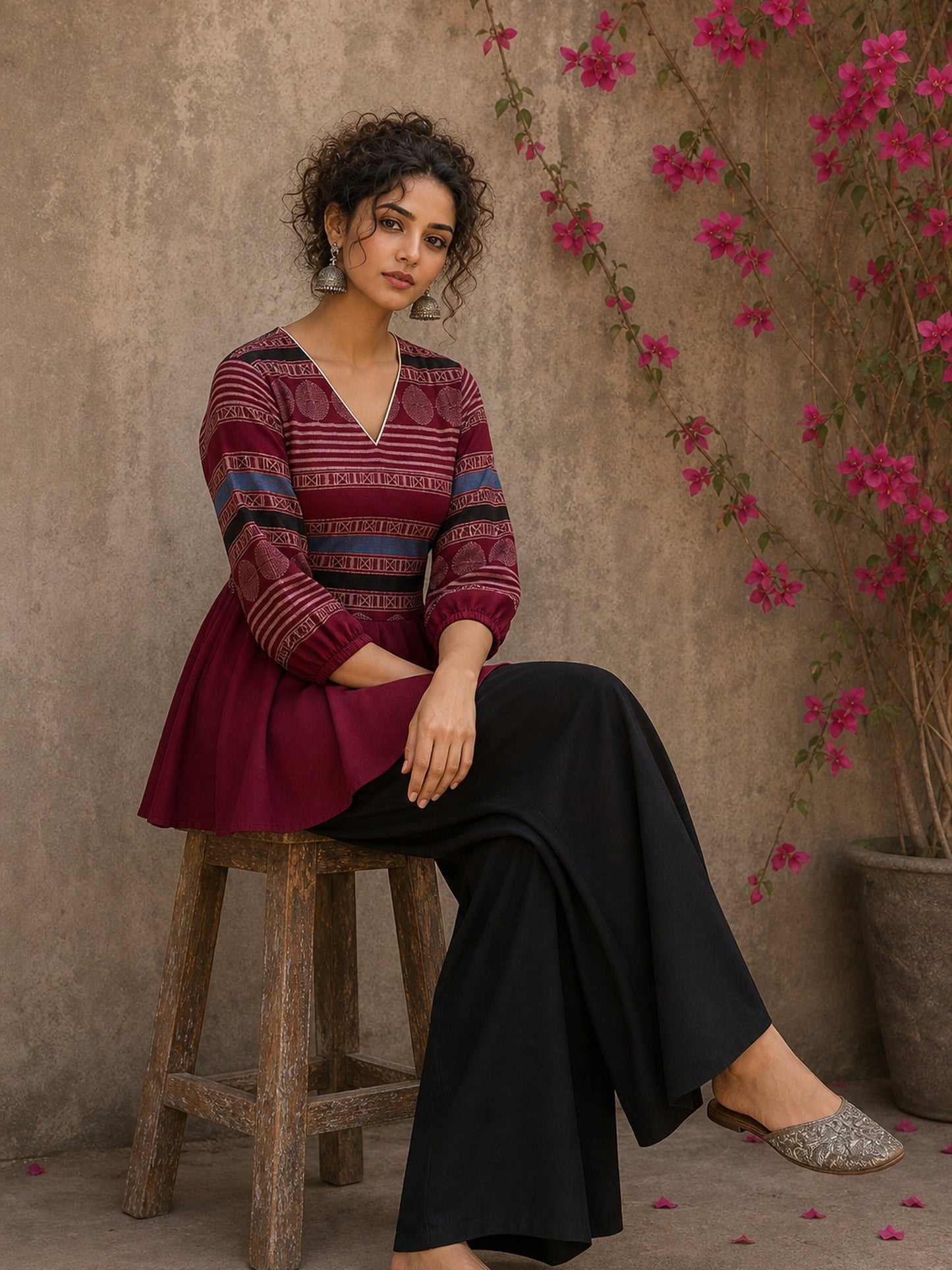 Bold and playful maroon hand block print peplum top with beige geometric motifs and subtle blue accents for effortlessly chic everyday style.