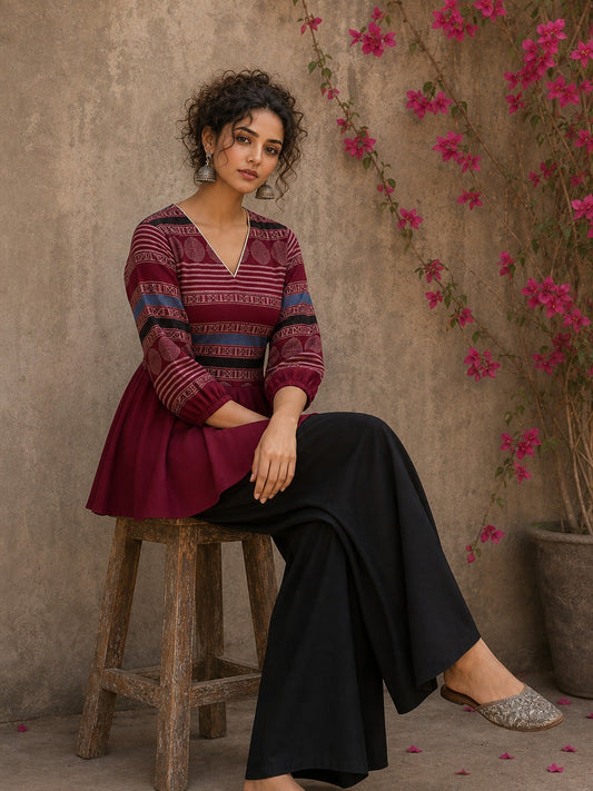 Bold and playful maroon hand block print peplum top with beige geometric motifs and subtle blue accents for effortlessly chic everyday style.