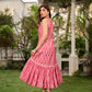 Graceful pink Ikat long dress accented in white, designed with gathered detailing at the fall and a clean sleeveless finish