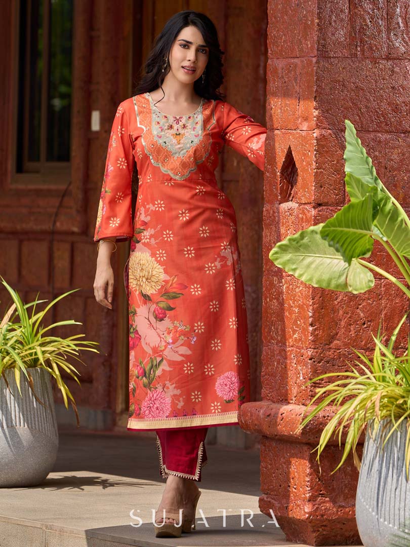 Elegant orange floral printed kurta with hand-embroidered sequin and cut dana detailing on the yoke and rich maroon accents.