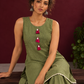 Sage Green Cotton Co-Ord Set with Pink Tassel Shell Buttons and Lace Trim Farshi Salwar — seated detail