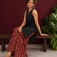 Black Sleeveless Keyhole Neck Tunic Co-Ord Set with Maroon Ajrakh Printed Cotton Farshi Salwar — seated
