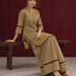 Classic Beige Cotton Co-Ord Set with Mandarin Collar Kurta and Lace Trim Straight Pants — seated
