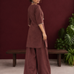 Brown Cotton Co-Ord Set with Contrast Cream Kantha Neckline & Cowrie Shell Tassels with Straight Fit Pant — in motion