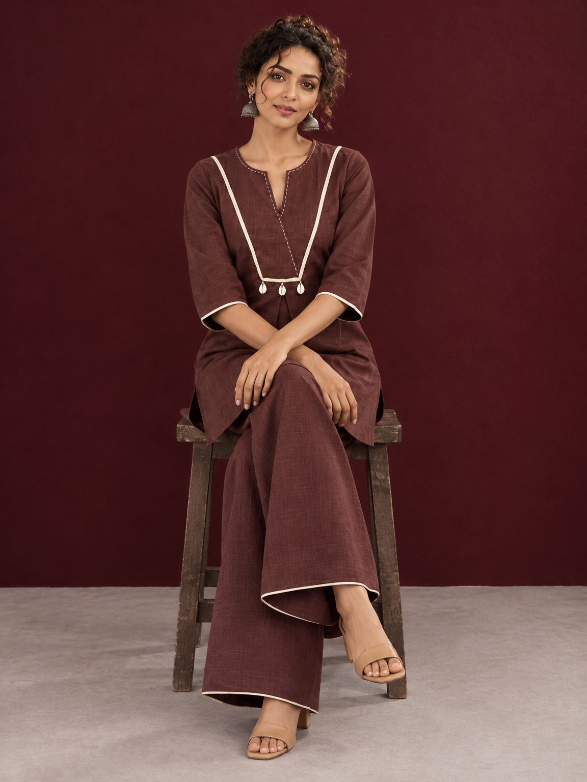 Brown Cotton Co-Ord Set with Contrast Cream Kantha Neckline & Cowrie Shell Tassels with Straight Fit Pant — seated