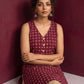 Maroon Printed Cotton Sleeveless Co-Ord Set with Polka Dot Motifs and Pleated Beige Farshi Salwar — seated detail
