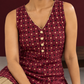 Maroon Printed Cotton Sleeveless Co-Ord Set with Polka Dot Motifs and Pleated Beige Farshi Salwar — fabric close-up
