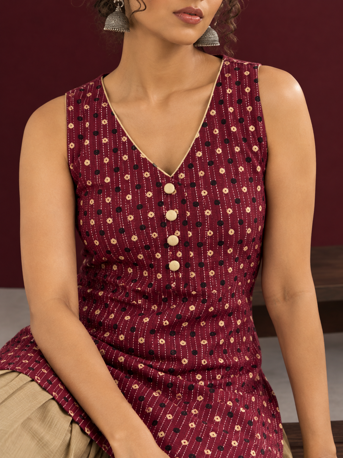 Maroon Printed Cotton Sleeveless Co-Ord Set with Polka Dot Motifs and Pleated Beige Farshi Salwar — fabric close-up