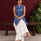 Blue Cotton Sleeveless Floral Printed Tunic Co-ord Set with White Cotton Farshi Salwar — seated