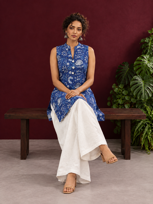 Blue Cotton Sleeveless Floral Printed Tunic Co-ord Set with White Cotton Farshi Salwar — seated