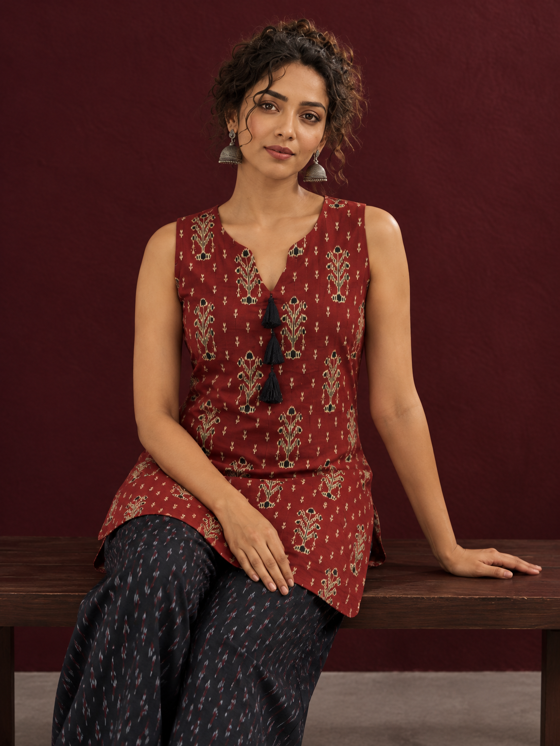 Rustic Maroon Cotton Ikat Printed Sleeveless Tunic Co-ord Set with Black Ikat Straight Pant — seated detail