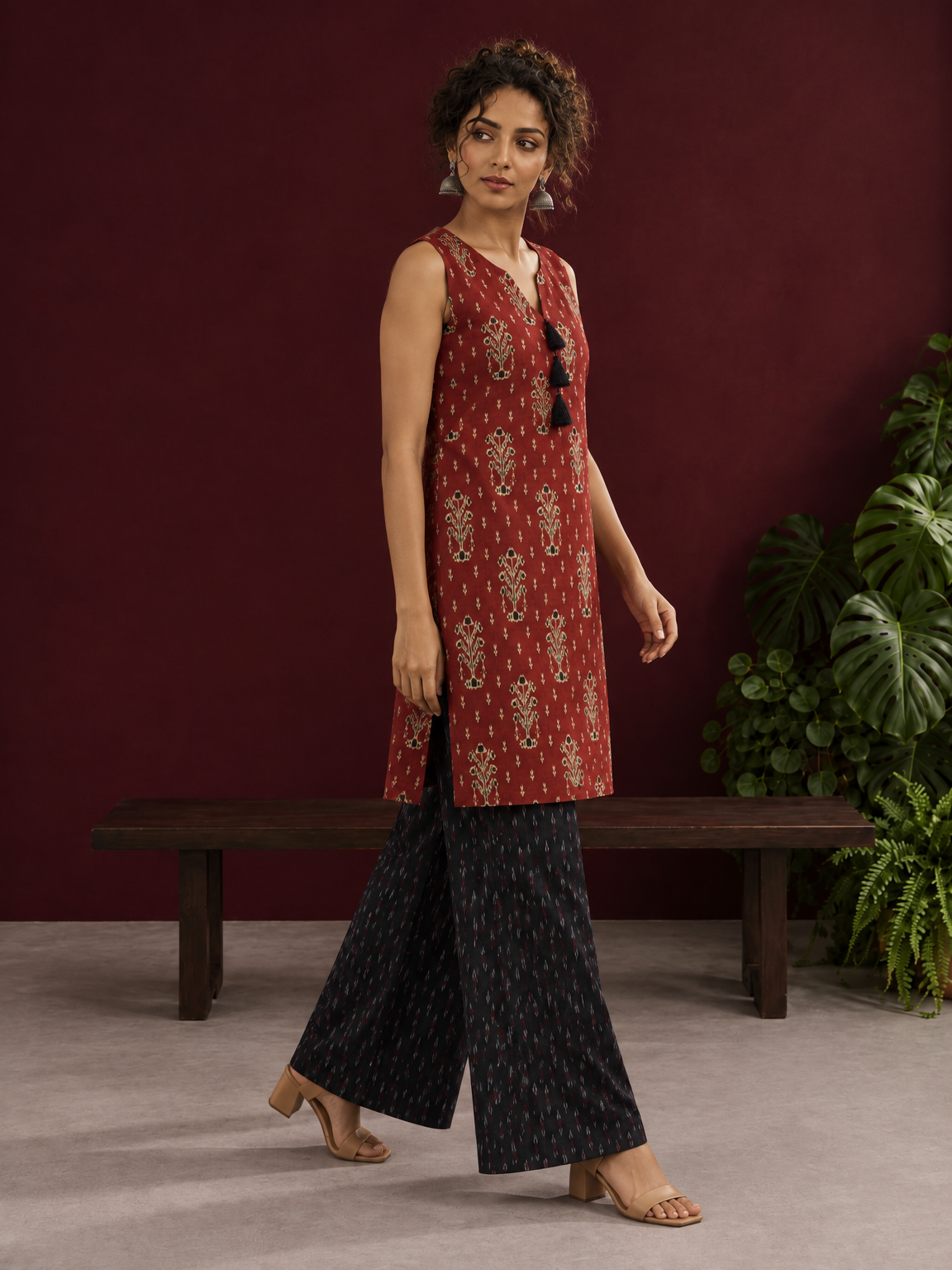 Rustic Maroon Cotton Ikat Printed Sleeveless Tunic Co-ord Set with Black Ikat Straight Pant — in motion