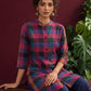Madras checks Cotton Co ord with Mandarin Collar and Contrast Navy Button Placket and navy blue Farshi Salwar — seated detail