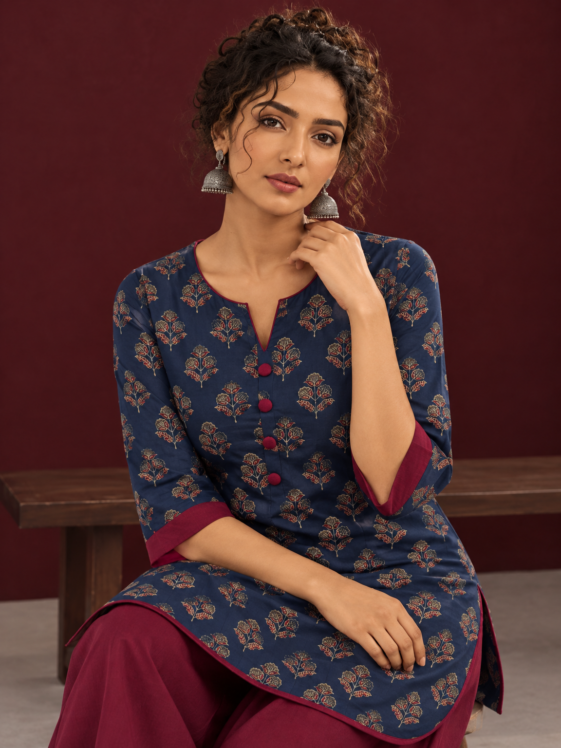 Navy Blue Cotton Kurta with Floral Ajrakh Print & Maroon Contrast Sleeve Cuffs and Maroon Farshi Salwar — seated detail