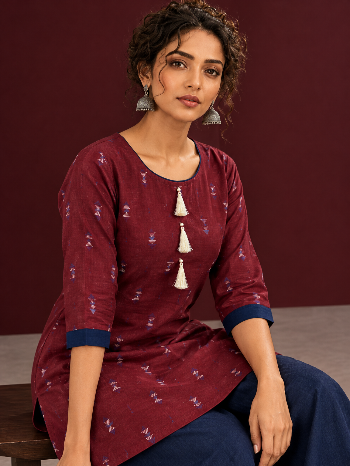 Classic Maroon Cotton Co ord with Navy Blue Contrast Trim and Triangle Print with Tassel Detailing with navy — seated detail