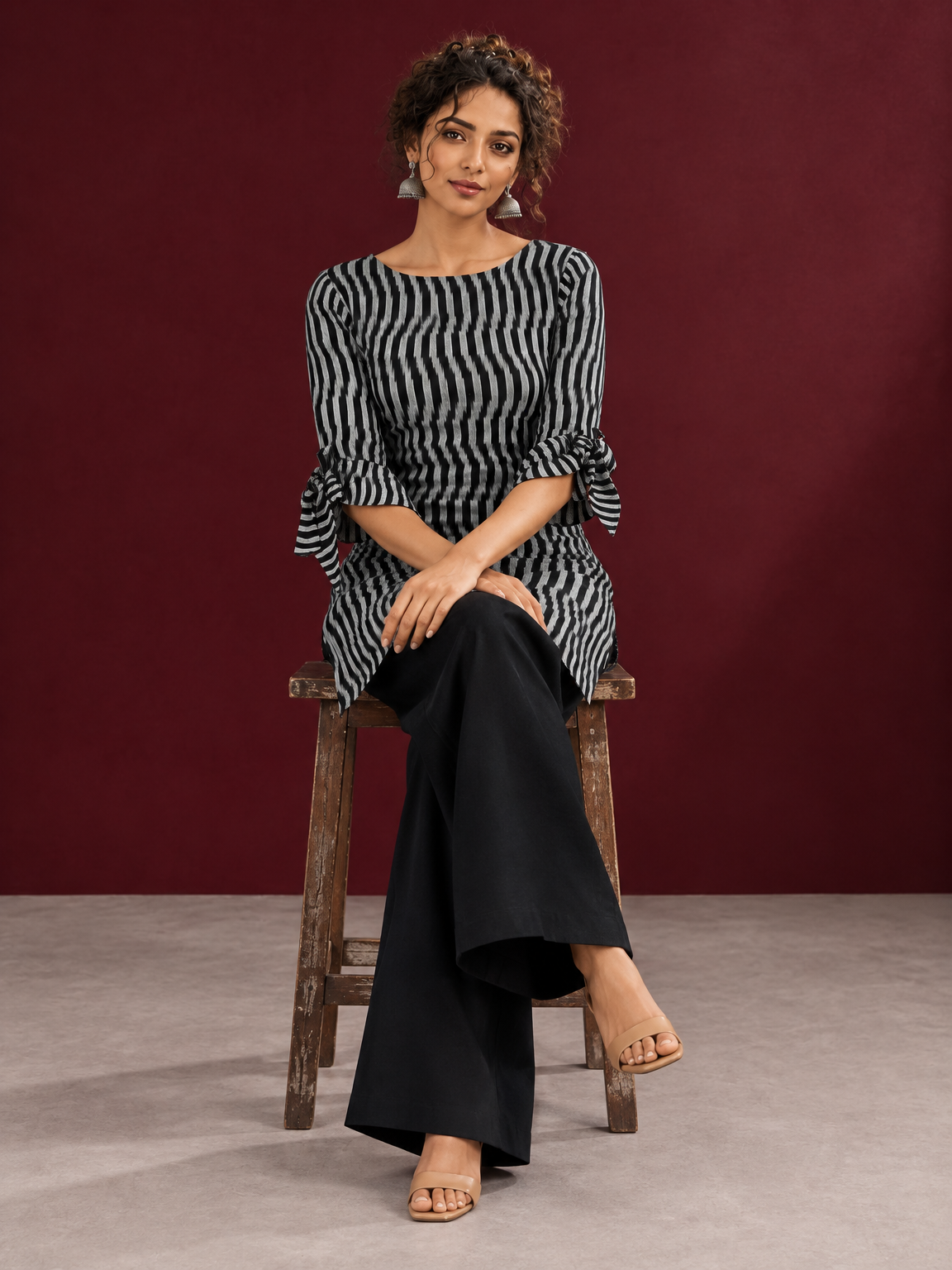 Monochrome Black and Grey Ikat Striped Cotton Coord with Tie-Up Bell Sleeve Cuffs and Buttons with Black Palazzo pan — seated