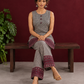 Classic Beige & Black Ajrakh Print Co-Ord Set with Maroon Floral Border Detail — seated
