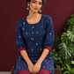 Navy Blue Cotton Co-Ord Set with Maroon Contrast Cuffs and Scoop Neckline Piping and maroon Farshi pants — seated detail