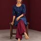 Navy Blue Cotton Co-Ord Set with Maroon Contrast Cuffs and Scoop Neckline Piping and maroon Farshi pants — seated