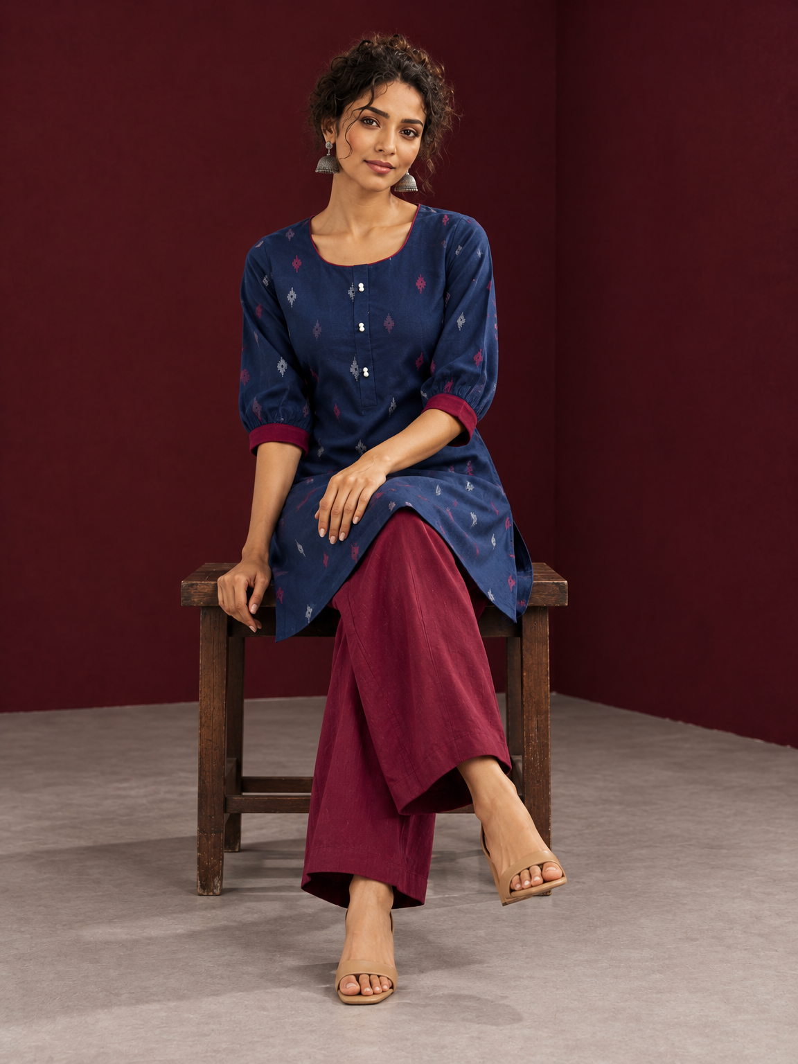 Navy Blue Cotton Co-Ord Set with Maroon Contrast Cuffs and Scoop Neckline Piping and maroon Farshi pants — seated