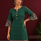 Bottle Green Ikat Cotton Co-Ord Set with Kalamkari Peacock Print Border on Sleeves and Hem with Maroon Farshi — fabric detail