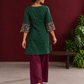 Bottle Green Ikat Cotton Co-Ord Set with Kalamkari Peacock Print Border on Sleeves and Hem with Maroon Farshi Col — back view