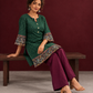 Bottle Green Ikat Cotton Co-Ord Set with Kalamkari Peacock Print Border on Sleeves and Hem with Maroon Farshi Collec — seated