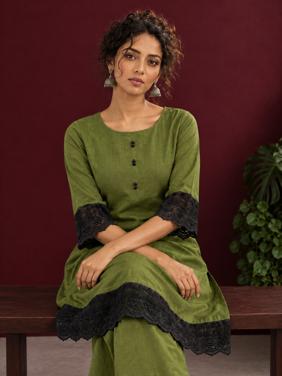 Elegant Olive Green Cotton Co-Ord Set with Contrast Black Floral Lace Hem and Cuffs with Straight olive pants — seated detail