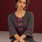 Classic Black & Beige Ajrakh Striped Cotton Co-Ord Set with Ikat Panel Neckline and Maroon Trim Details — seated detail