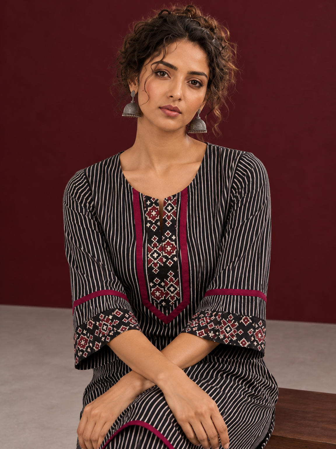 Classic Black & Beige Ajrakh Striped Cotton Co-Ord Set with Ikat Panel Neckline and Maroon Trim Details — seated detail
