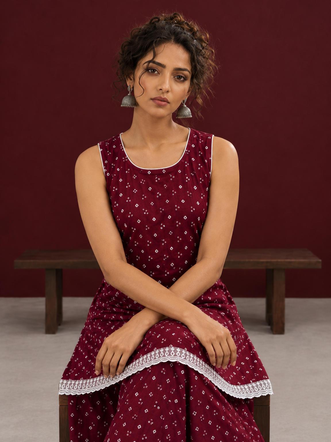 Elegant Maroon Bandhani Print Co-Ord Set with Lace Trim Hem and Scoop Neckline — seated detail