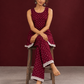 Elegant Maroon Bandhani Print Co-Ord Set with Lace Trim Hem and Scoop Neckline — seated