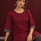 Timeless Maroon Ajrakh Cotton Co-Ord Set with Contrast Printed Border Tunic & Matching Geometric Pattern Fars — seated detail